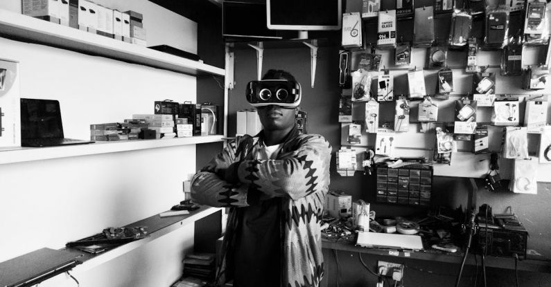 Customer Experiences - Black man in VR goggles in electronics store