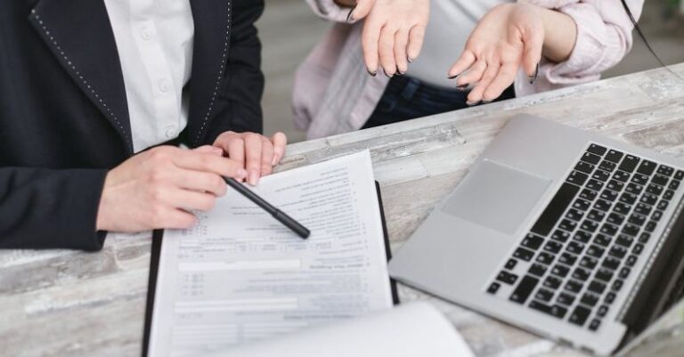 Customer Data - A Person Holding a Black Pen