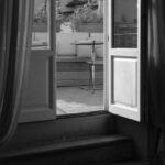 Open Rates - A black and white photo of a window with a view