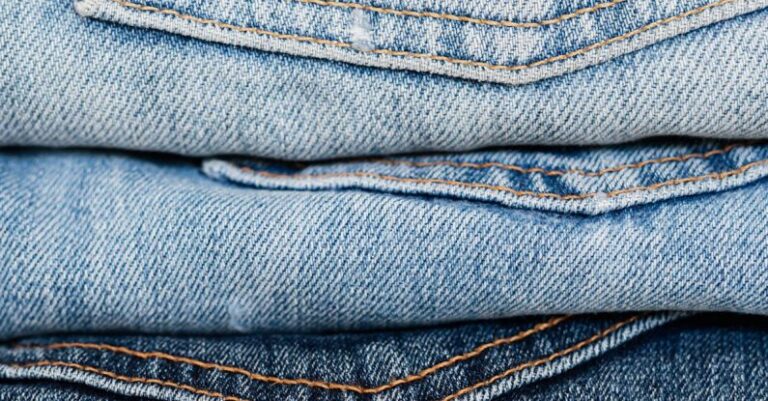 Quality Score - Stack of blue jeans arranged by color