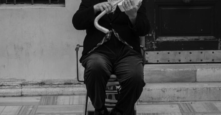 Website Performance - A man in top hat and cane playing violin