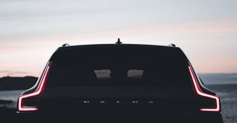 Brand Consistency - The rear end of a volvo car at sunset