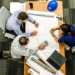 Reputation Management - Three People Sitting Beside Table