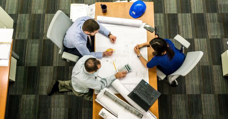 Reputation Management - Three People Sitting Beside Table