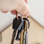 Legal Considerations - Person with keys for real estate