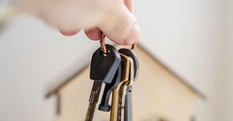 Legal Considerations - Person with keys for real estate